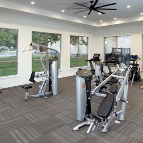 24-hour fitness center with cardio machines and strength equipment