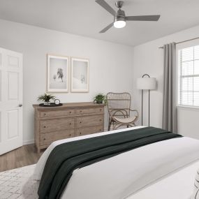 Bedroom with modern ceiling fan and wood-style flooring at Camden Stoneleigh apartments in Austin, TX.