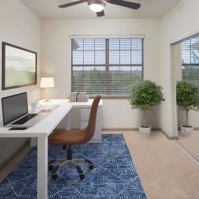 Den office space with window and mirrored closet at Camden Stoneleigh