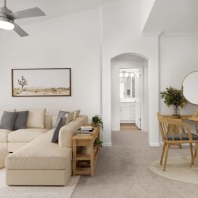 Living room and dining room with extended ceilings and plush carpet at Camden Stoneleigh apartments in Austin, TX.