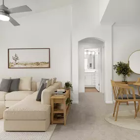 Living room and dining room with extended ceilings and plush carpet at Camden Stoneleigh apartments in Austin, TX.