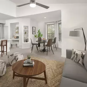 Living room, dining room and kitchen with extended ceiling and plush carpet at Camden Stoneleigh apartments in Austin, TX.