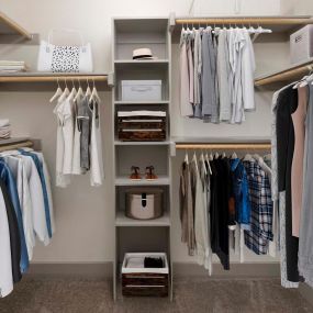 Walk in closet with wood shelving