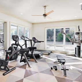 24 hour fitness center with cardio equipment and free weights