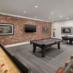 Resident lounge with shuffleboard billiards and poker table