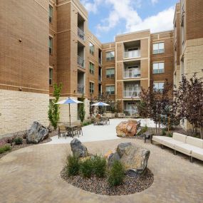 Outdoor lounge courtyard at Camden Lincoln Station Apartments in Lone Tree, CO