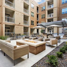 Courtyard with fire pit at Camden Lincoln Station Apartments in Lone Tree, CO