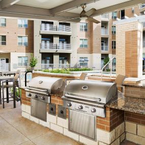 Poolside outdoor grills at Camden Lincoln Station Apartments in Lone Tree, CO