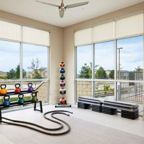Fitness center yoga and cardio equipment at Camden Lincoln Station Apartments in Lone Tree, CO