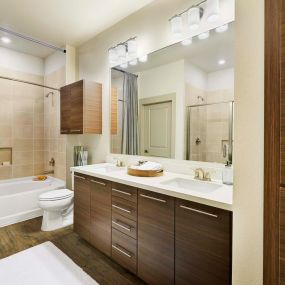 Model bathroom dual sinks at Camden Lincoln Station Apartments in Lone Tree, CO