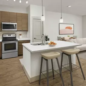 Kitchen with breakfast bar and stainless steel appliances at Camden Lincoln Station in Lone Tree, CO