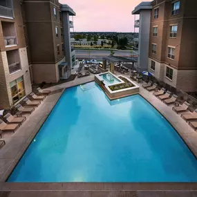 Swimming pool at dusk at Camden Lincoln Station Apartments in Lone Tree, CO