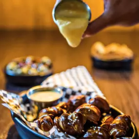 Hot pretzel bites with a cheesy sauce