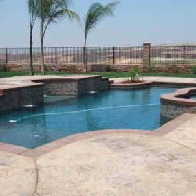 Custom Inground Pool with Retaining Wall and Spa