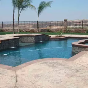 Custom Inground Pool with Retaining Wall and Spa