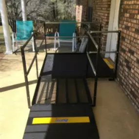 The Amramp Birmingham team provides access to this lovely front porch for a home in Mt. Olive, Alabama with a small wheelchair ramp and platform.