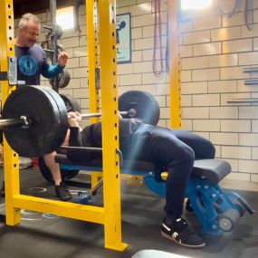 Rich is driving hard out of the bottom of his Bench Press.