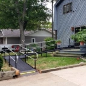 The Amramp accessibility experts found a creative way to provide wheelchair access to the front porch from the side for a home in Saginaw, MI.
