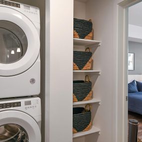 Front-load stacked washer and dryer included at The Huntington luxury apartments in Duarte, CA.