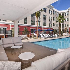 Poolside lounge seating at The Huntington luxury apartments in Duarte, CA