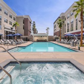 Resort-style pool & heated spa at The Huntington luxury apartments in Duarte, CA.