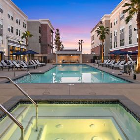 Resort-style pool and heated spa at The Huntington luxury apartments in Duarte, CA.