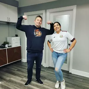 Dimitri Kondos state farm insurance agent showing his school spirit at his Milwaukie office