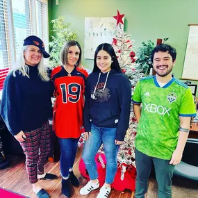 Dimitri Kondos State farm insurance agent and team showing their school spirit at their Milwaukie, OR office