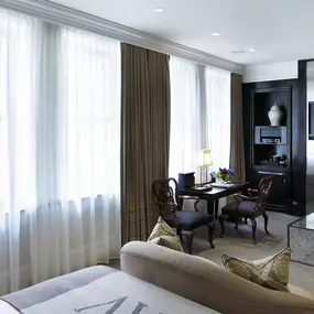 Beacon Hill Studio Room - Approximately 485 square feet with a luxurious sitting area and views of historic Beacon Street. In front of the fireplace – a love seat or two comfortable arm chairs with an ottoman