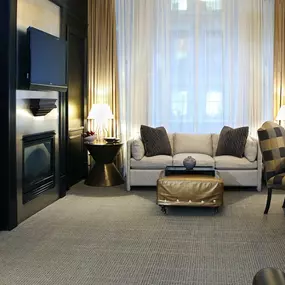 Boston Common Studio - 485 square feet. Sun filled sitting area with corner views of historic Beacon Street. Comfortable Queen size pull-out sofa bed ($35.00 charge) in front of the fireplace, 42