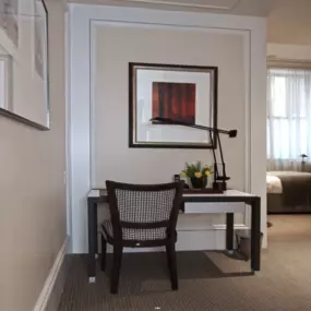 The Classic luxury hotel room accommodation at our Boston hotel is approximately 300 square feet with a walk-in rainforest shower. It has a spacious work area with a desk and comfortable chair in front of the fireplace. This room comes equipped with a Smart TV and a Queen sized bed. Find more detail about our Classic Hotel Rooms below.