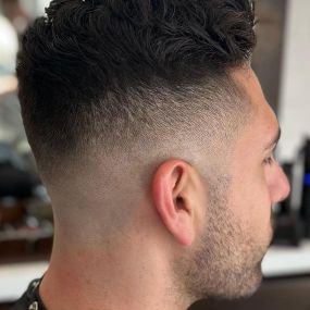 Mid Skin Fade Haircut with Length on Top