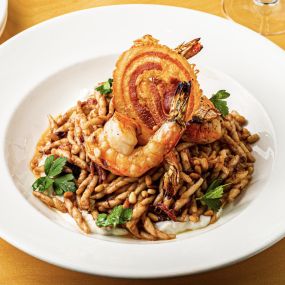 Fall 2022 Grilled Shrimp and Trofie Pasta  with Radicchio pesto, pancetta, red wine braised onions, whipped ricotta, toasted pine nuts