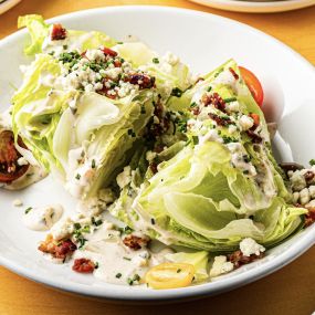 Fall 2022 Wedge salad with crispy bacon, point reyes blue, tomato, ranch