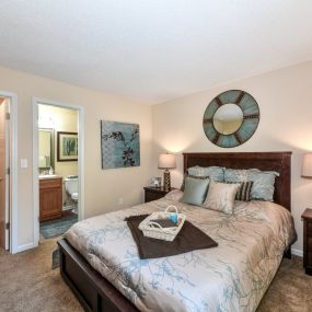 Master Bedroom Feels Large and Spacious with Impressive 9 Foot Ceilings and Large Walk-In Closets at Pointe Royal Townhome Apartments