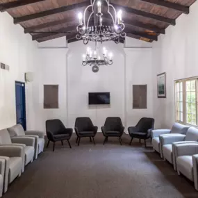 Group therapy room with soft seating and natural light, used for evidence-based sessions in the women’s mental health program.