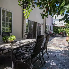 Garden patio with table and chairs at Clearview’s gender-inclusive residential program, designed for peer connection and support.