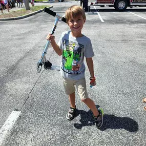 We gave out 9 scooters yesterday at the back to school event!  Here are some of the lucky winners ????