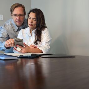 Jon and Bianca at work in the office