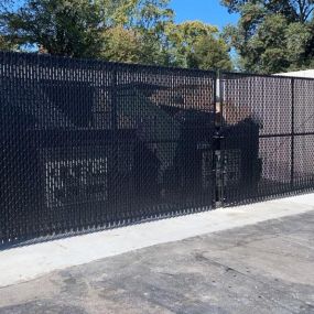 Dumpster enclosure with privacy slats