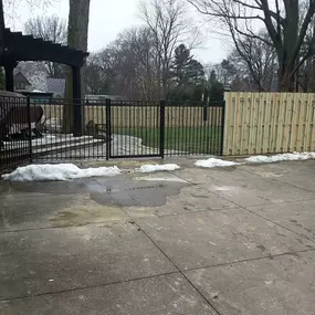 Aluminum fence with wood shadow box style