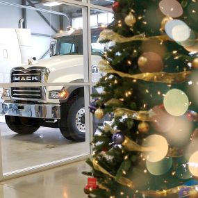 A Christmas tree in front of a Mack truck at RDO Truck Center in Fargo, ND.