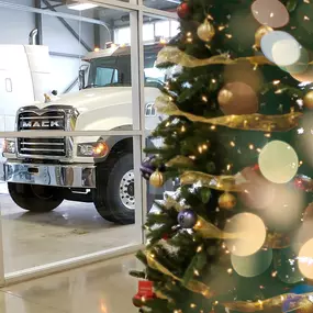 A Christmas tree in front of a Mack truck at RDO Truck Center in Fargo, ND.