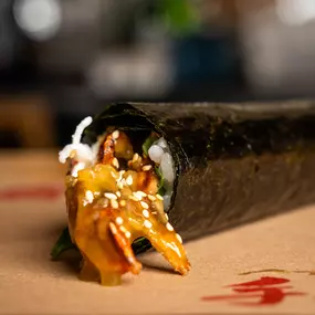 The KATANA Hand Roll features Tempura Fried Soft Shell Crab, Shiso, Kani, Yuzu Kosho Sauce, Goma.