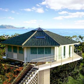 Built on a steep mountainside in Hawaii, this low-maintenance, seismic-resistant home was designed to provide extraordinary panoramic views of the Pacific Ocean.