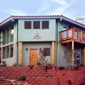 This two-story home combines a variety of design elements, creating a unique home that blends in well with its rugged southwestern setting.