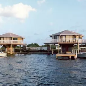 Cantilevered over the water’s edge and overlooking the Caribbean Sea on a small private Cay in Belize, these Topsider hurricane-resistant pedestal homes make for the perfect tropical vacation getaway.
