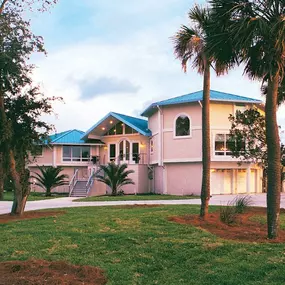 This coastal South Carolina hurricane-resistant home was built on concrete piers with the ground level area enclosed. “Flood vents” at ground level allow storm surge water to flow through without degrading the structural integrity of the house.