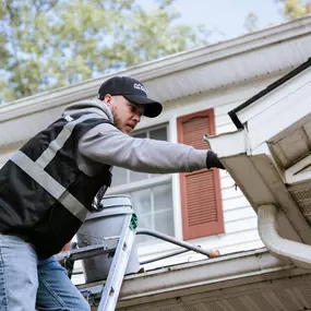 The Gutter Boys installing gutters