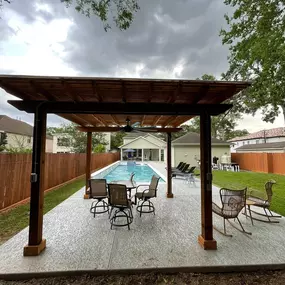 Geometric pool with waterfalls and pergola